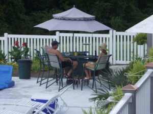 Town and Country F-1 Series Vinyl Fence by Pool